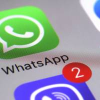 WhatsApp appears on a smartphone in New York in this March 10 file photo. WhatsApp users in China report disruption amid censorship fears