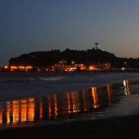 The lighthouse, known as Enoshima Sea Candle, is lit up on the night of July 14. Enoshima: An island in the spotlight