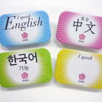 The Kansai Tourism Bureau is giving badges to volunteer guides in the region that indicate which languages they can speak. | KYODO