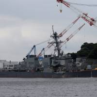 The Arleigh Burke-class guided-missile destroyer USS Fitzgerald, damaged in a collision with a Philippine-flagged merchant vessel, is seen at the U.S. naval base in Yokosuka on June 18. | REUTERS