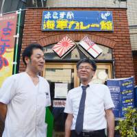 Chef Hideki Kurita (left) and restaurant manager Toshiyuki Takahashi stand in front of their restaurant, Gyorantei, in the naval port city of Yokosuka, Kanagawa Prefecture, on July 12. The restaurant will close down at the end of August. | KYODO