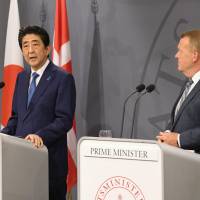 Prime Minister Shinzo Abe speaks during a joint news conference with his Danish counterpart Lars Lokke Rasmussen on Monday in Copenhagen. | KYODO