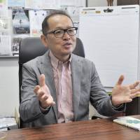 Takashi Maeno, the dean of the Graduate School of System Design and Management at Keio University, speaks about his studies on happiness during an interview at the university\'s campus in Yokohama in June. | YOSHIAKI MIURA