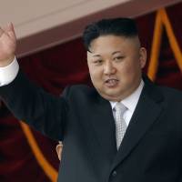 North Korean leader Kim Jong Un waves during a military parade in Pyongyang on April 15. | AP