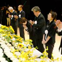 Kin of people who died in the July 2007 earthquake that hit Niigata and surrounding prefectures offer prayers at a ceremony held Sunday to mark the 10th anniversary of the disaster in Kashiwazaki, Niigata Prefecture. | KYODO