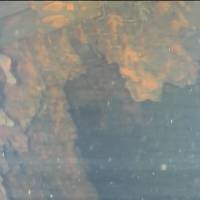 What could be fuel debris is shown around a control rod drive at the bottom of the pressure vessel of reactor 3 at the Fukushima No. 1 power plant on Friday. International Research Institute for Nuclear Decommissioning Fukushima robot finds potential fuel debris hanging like icicles in reactor 3