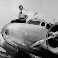 Amelia Earhart sits on the nose of her aircraft before takeoff in Miami in 1937. 80 years on, mystery of U.S. aviatrix Amelia Earhart's disappearance over the Pacific remains unresolved