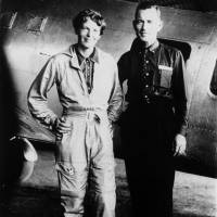 Amelia Earhart and her navigator, Fred Noonan, pose for a photo in front of their twin-engine Lockheed Electra in Los Angeles at the end of May 1937. | AP