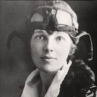 U.S. aviatrix Amelia Earhart poses for a portrait in her flying gear in an undated photograph. | PUBLIC DOMAIN