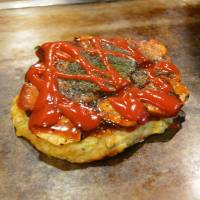 A change from the norm: A fried potato and prawn okonomiyaki topped with tomato ketchup. Kiji: Innovation and tradition in 'okonomiyaki'
