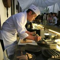 Cultural ambassador: Sushi chef Takaaki Sugita hard at work in Ibiza\'s Lemuella. | ROBBIE SWINNERTON
