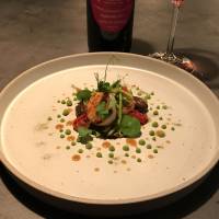 Substance to complement style: a plate of scallops with pea greens and wild asparagus. S'accapau