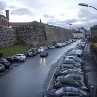 Electric vehicles sit parked at charging stations in Oslo on Nov. 21, 2016, but consumers are still a long  way from completely ditching gasoline-powered cars. | BLOOMBERG