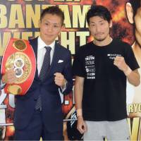 IBF super bantamweight champion Yukinori Oguni (left) and challenger Ryosuke Iwasa attend a news conference to promote their September title fight. | KYODO