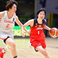 Manami Fujioka drives against a Chinese player in their semifinal game at the FIBA Women\'s Asia Cup on Friday night in Bangalore, India. | KYODO