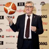 Julio Lamas, the new Japan men’s national team head coach, poses for photographers during his introductory news conference on Friday. New coach Lamas wants Japan to play fast-breaking style
