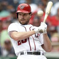 Washington’s Daniel Murphy dodges a pitch against Milwaukee in the third inning on Thursday. Nats bash Brewers with eight-homer barrage, including five in third inning