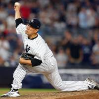 New York’s Masahiro Tanaka fires a pitch against Tampa Bay in the eighth inning on Friday night. Yankees hurler Tanaka dazzles in 14-K outing