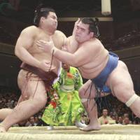 New ozeki Takayasu (left) says he is calm heading into the Nagoya Grand Sumo Tournament that starts on Sunday. | KYODO