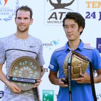 Antalya Open champion Yuichi Sugita (right) and runner-up Adrian Mannarino pose with their prizes after Saturday’s final in Antalya, Turkey. Sugita captures first ATP tour title