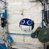 A robot drone that takes pictures and videos inside the International Space Station is shown in this image released by Japan Aerospace Exploration Agency (JAXA). Int-Ball, a floating camera which is 15-cm in diameter weighing about 1 kg, can be remote-controlled from the earth. JAXA started experimenting with Int-Ball on Friday. | KYODO