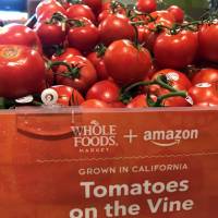 Tomatoes are pictured at a Whole Foods store in San Diego, California, Monday. Merger done: Whole Foods cuts prices, debuts 'farm fresh' Amazon Echo assistance