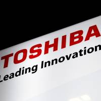 Toshiba Corp.’s company logo is seen at JR Hamamatsucho Station in Minato Ward. Toshiba President Satoshi Tsunakawa will hold a news conference Thursday to explain the firm’s financial statement. Toshiba to gain qualified auditor approval for fiscal 2016 earnings, sources say