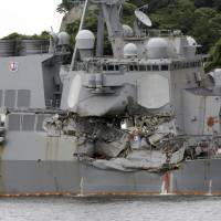 Tthe damaged USS Fitzgerald is docked June 18 at the U.S. Naval base in Yokosuka, Kanagawa Prefecture, after colliding with the Philippine-flagged containership ACX Crystal off Japan. Mississippi shipyard contracted to repair collision-damaged USS Fitzgerald