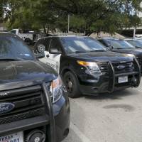 Austin police Ford utility vehicles are parked on East Eighth Street outside police headquarters in Austin, Texas, July 11. The Austin Police Department on July 28 pulled nearly 400 Ford Explorer SUVs from its patrol fleet over worries about exhaust fumes inside the vehicles. The move comes as U.S. auto safety regulators investigate complaints of exhaust fume problems in more than 1.3 million Explorers from the 2011 through 2017 model years. Ford working with police forces to fix carbon monoxide issue involving Explorer SUVs