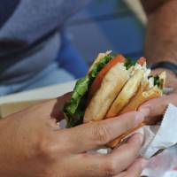 A man eats a chicken sandwich at a McDonald’s restaurant in Oak Brook, Illionis, in 2015. McDonalds says it will start globally rolling back use of antibiotics in its chicken products from 2018 as part of efforts to curb microbial resistance to drugs and the rise of superbugs. McDonalds to roll back global use of antibiotics in chicken products in 2018