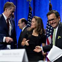 Bob Lighthizer, U.S. trade representative, left, talks to Chrystia Freeland, Canada’s minister of foreign affairs, center, and Ildefonso Guajardo Villarreal, secretary of economy for Mexico, right, after opening statements during the first round of North American Free Trade Agreement (NAFTA) renegotiations in Washington on Wednesday. U.S. talks tough on trade deficit as talks on NAFTA revisions begin