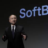 SoftBank chief Masayoshi Son speaks at a news conference in Tokyo. The firm has invested &#36;250 million into online lender Kabbage Inc. in the latest in a flurry of big bets on mature startups. | BLOOMBERG