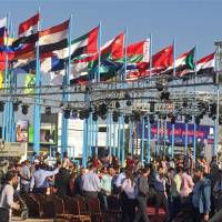 People attend Syria’s first international trade fair since war broke out in 2011, a few kilometers away from the rebel-held eastern suburbs of Damascus Thursday. Syria boasts business 'comeback' with international trade fair in Damascus