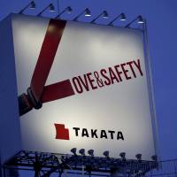 A billboard advertisement of Takata Corp. is pictured in Tokyo in 2014. Delaware bankruptcy judge OKs Takata request to halt some lawsuits over air bag inflators