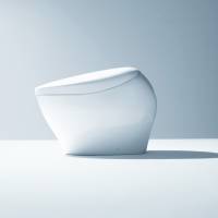 The Neorest NX with a domestic price of ¥615,600 ($5,590), features a curvy integrated toilet seat cover and bowl. | KYODO