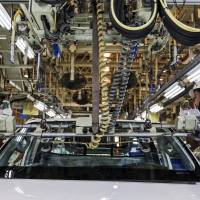 Workers assemble a car at a Toyota Motor Corp. plant in Ban Pho, Chachoengsao province, Thailand. | BLOOMBERG