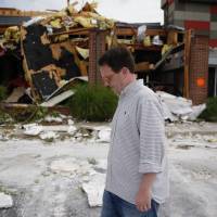 Mayor G.T. Bynum tours tornado damage outside of a TGIFridays restaurant in Tulsa, Oklahoma, Monday. Meteorologists said that three tornadoes struck northeast Oklahoma early Sunday. This property condemned: Tulsa twister knocks out 10 businesses