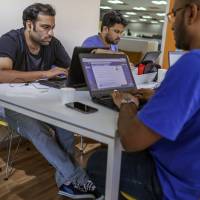 Flipkart employees work at the company\'s headquarters in Bangalore, India. | BLOOMBERG