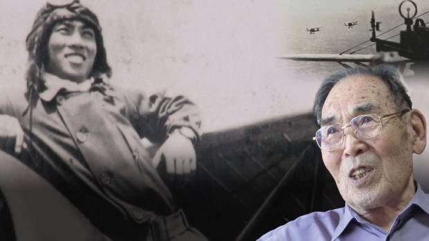 Telling stories: Kaname Harada is seen in front of a picture of himself from the war. Documentary shows former Imperial Navy pilot's cry for peace