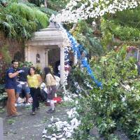 The area affected by a tree fell that fell on people in Funchal, Portugal, is shown on Tuesday. Falling tree kills 13 at Portuguese festival