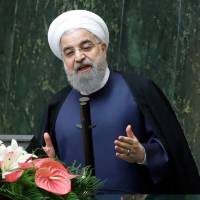 Iranian President Hassan Rouhani delivers a speach to the parliament in Tehran on Sunday. Iran warns only five days needed to ramp up uranium enrichment