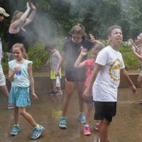Visitors to the Henry Doorly Zoo in Omaha, Nebraska, cool off at a misting station on July 11 as temperatures reached 95 degrees Fahrenheit (35 Celsius). July's global land temperatures were the hottest ever recorded