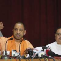 Indian Health Minister J.P. Nadda (right) looks on as Uttar Pradesh state Chief Minister Yogi Adityanath addresses a news conference after visiting the Baba Raghav Das Medical College Hospital in Gorakhpur, India, on Sunday. Indian state suspends hospital chief following deaths of 60 children