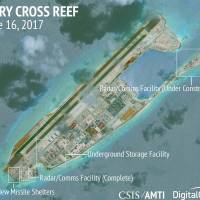 Construction is underway on Fiery Cross Reef, part of the Spratly island chain in the disputed South China Sea, in this June 16 satellite image. ASEAN vexed by South China Sea disputes as Phnom Penh backs Beijing