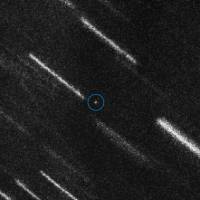 This handout picture released by the European Space Agency on Thursday shows near-Earth Asteroid 2012 TC4 appearing as a dot at the center of this composite of 37 individual 50-second exposures obtained with the FORS2 instrument on ESO’s Very Large Telescope. An asteroid the size of a house will shave past Earth at a distance of some 44,000 km (27,300 miles) in October, inside the moon’s orbit, astronomers said. The space rock will zoom by at an eighth of the distance from the Earth to the moon — far enough to just miss our geostationary satellites. Asteroid the size of house to shave past Earth, within moon's orbit, on Oct. 12: ESA
