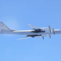 A Russian TU-95 bomber flies over around southern part of Japan in this handout picture taken by the Air Self-Defence Force and released by the Joint Staff Office of the Defense Ministry of Japan Wednesday. Russian nuclear bombers fly near North Korea in rare show of force, prompting fighter scrambles