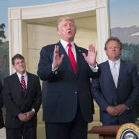U.S. President Donald Trump responds to a question from a member of the media after signing a memorandum on addressing China’s laws, policies, practices and actions related to intellectual property, innovation and technology in the Diplomatic Reception Room of the White House in Washington, on Monday, Aug. 14, 2017. Trump ups ante with China, orders inquiry over trade ties as Beijing protests