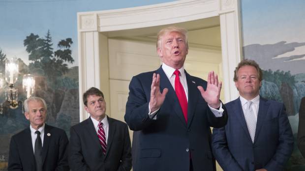 U.S. President Donald Trump responds to a question from a member of the media after signing a memorandum on addressing China’s laws, policies, practices and actions related to intellectual property, innovation and technology in the Diplomatic Reception Room of the White House in Washington, on Monday, Aug. 14, 2017. Trump ups ante with China, orders inquiry over trade ties as Beijing protests