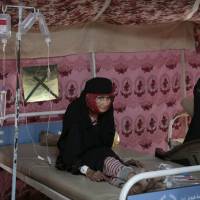 An elderly woman is treated for suspected cholera infection at a hospital in Sanaa July 29. Yemen’s raging two-year conflict has served as an incubator for lethal cholera. Civil war seen turning Yemen into deadly cholera incubator