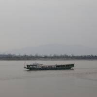 A long boat sails near the port of Chiang Saen on the Thai side of the Golden Triangle at the border between Thailand, Laos and Myanmar on the Mekong River in 2016. | REUTERS